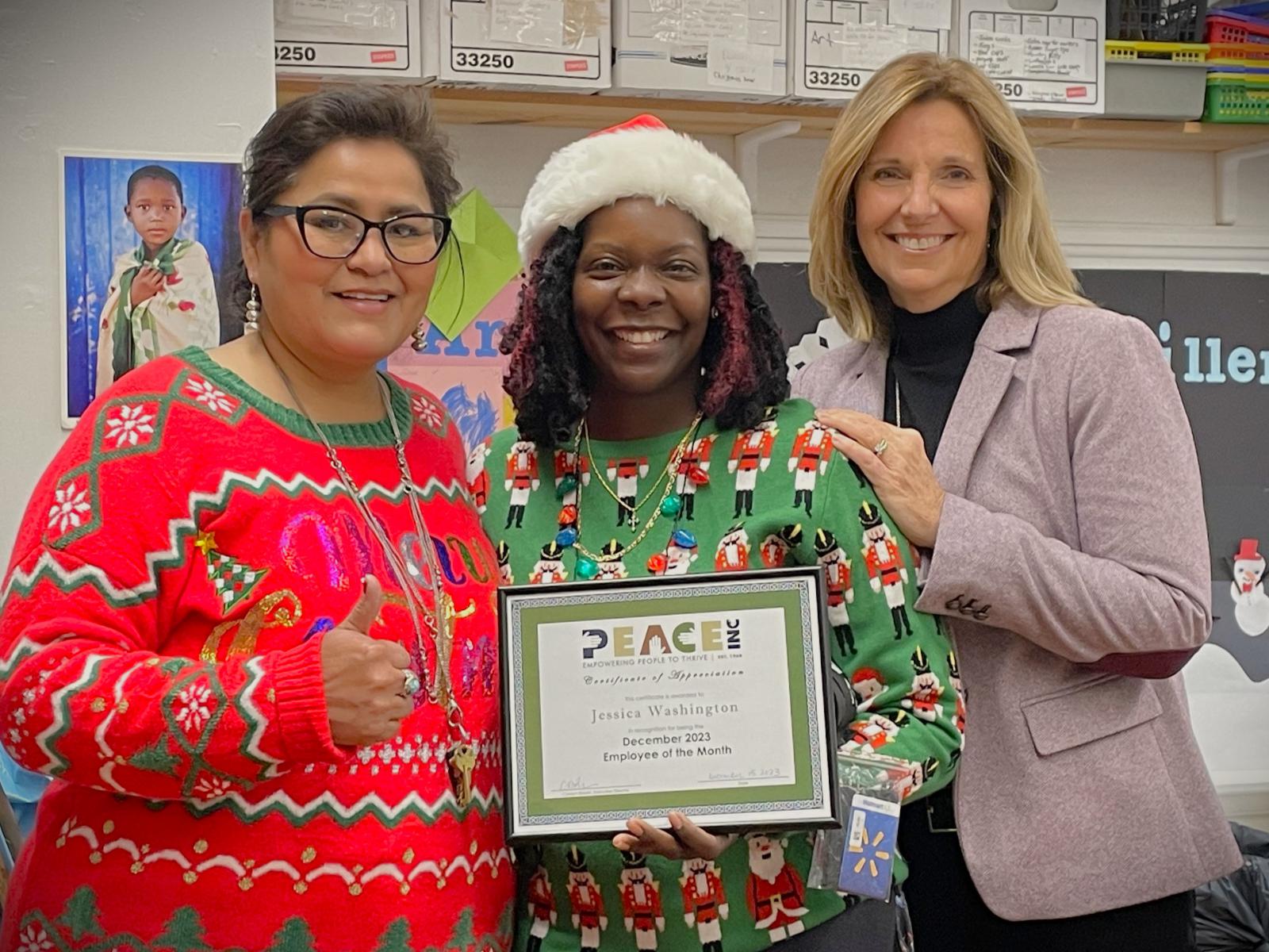 Employee of the Month Jessica Washington, with (left to right) Merrick Site Supervisor Sharon Bean and Executive Director Carolyn Brown